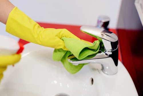 Careful dusting and polishing in a Belgravia home interior