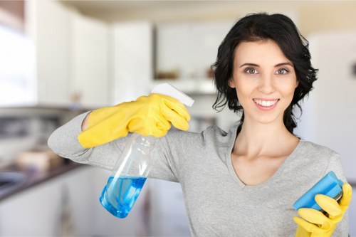 Cleaning operator preparing carpet cleaning equipment safely