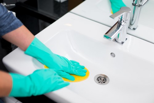 Staff member trained in safe carpet cleaning practices